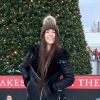 Lydia Gilbert, MSc Criminal Justice and Criminology student smiling in front of a Christmas tree