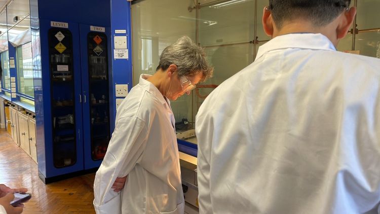 Prof. Vanessa Kind observing a laboratory experiment