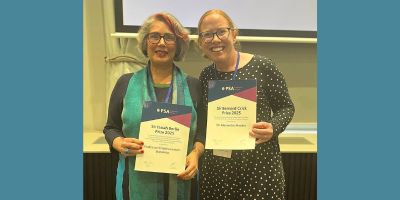 Cristina Leston-Bandeira and Alex Meakin hold up their PSA Awards