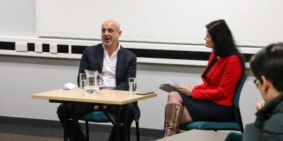 David Bearman, School of Law alum and Dr Virag Blazsek are talking to each other in front of an audience.