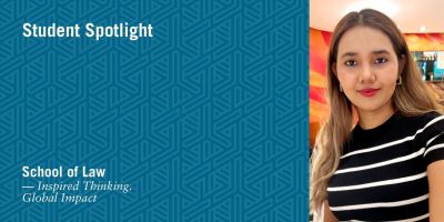 Student Spotlight featuring a young woman with long, light brown hair, wearing a black and white striped top, posing in a well-lit indoor setting. The left side of the image has a blue patterned background with white text that reads 'Student Spotlight'