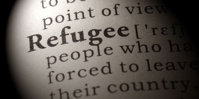 Page of dictionary defining the word refugee