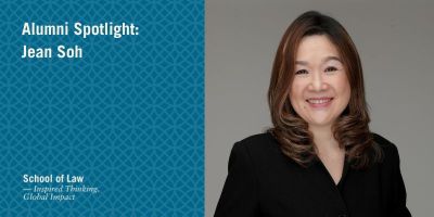Jean Soh smiling, wearing a black suit. Text reads: Alumni Spotlight: Jean Soh