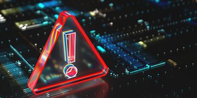A close up of the inside of a computer with a large red exclamation mark over it in a red triangle.