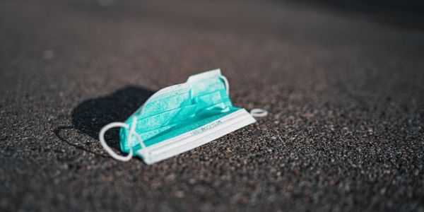 Discarded face mask on tarmac