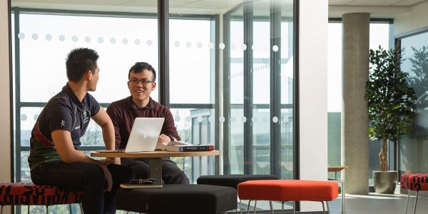 Students sitting at a laptop in the Liberty Building