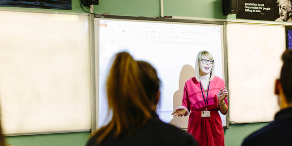 Teacher talking to students