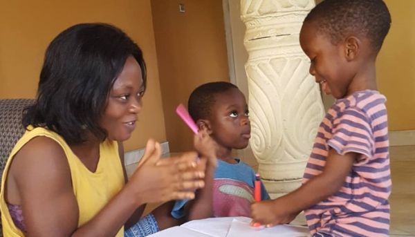 Parent and child doing schoolwork in ghana