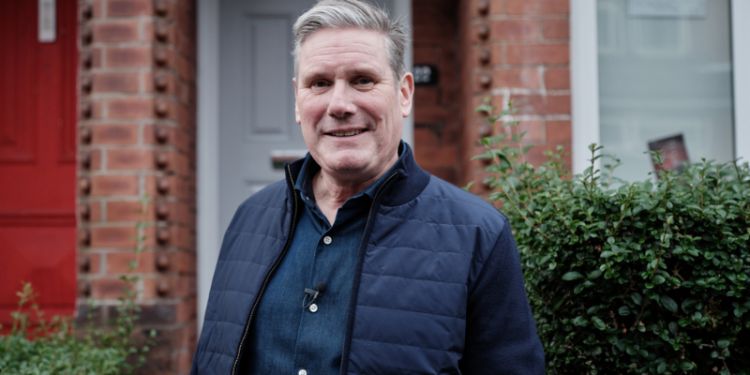 Sir Keir Starmer outside a house